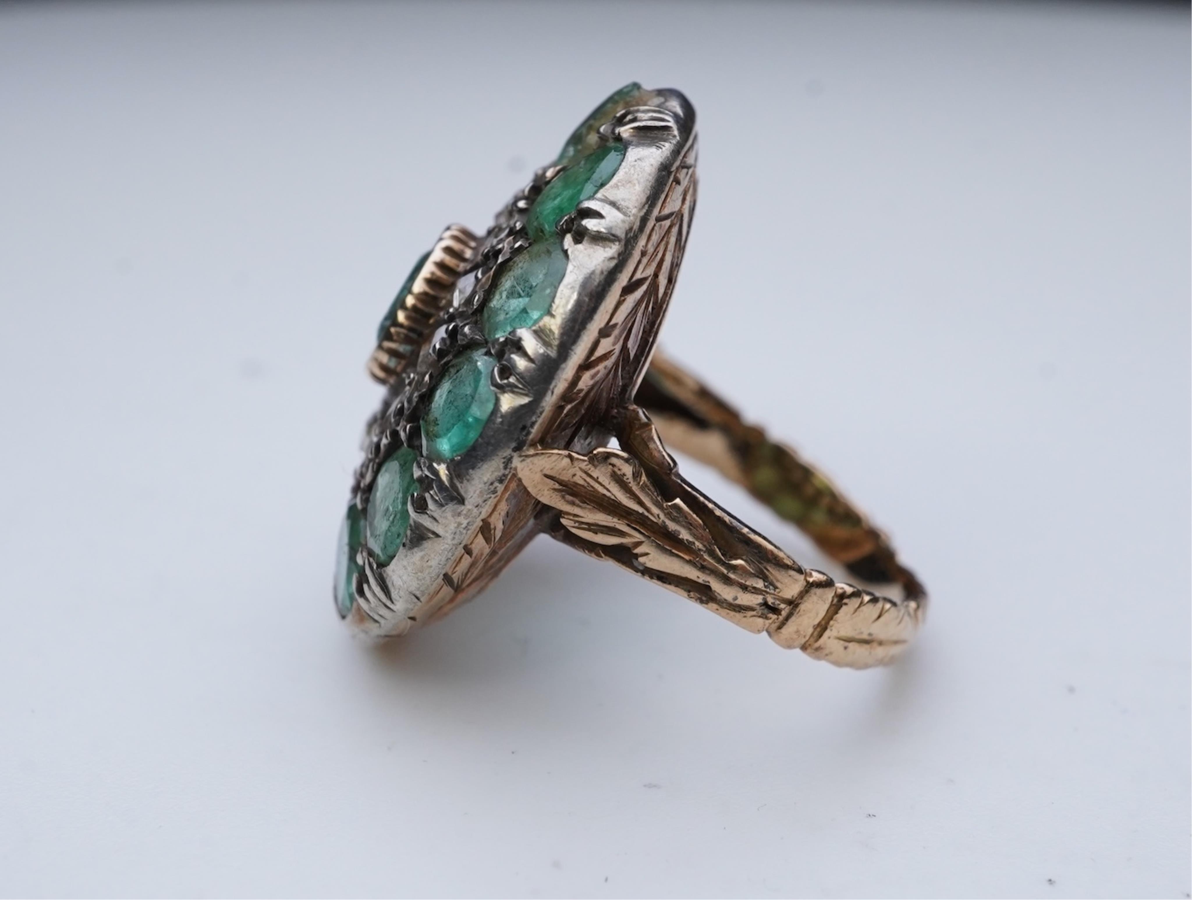 An emerald and diamond ring